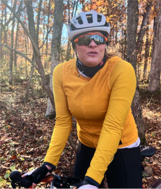 delighted hisspanic female hiker in woods CA5N4MH.jpg