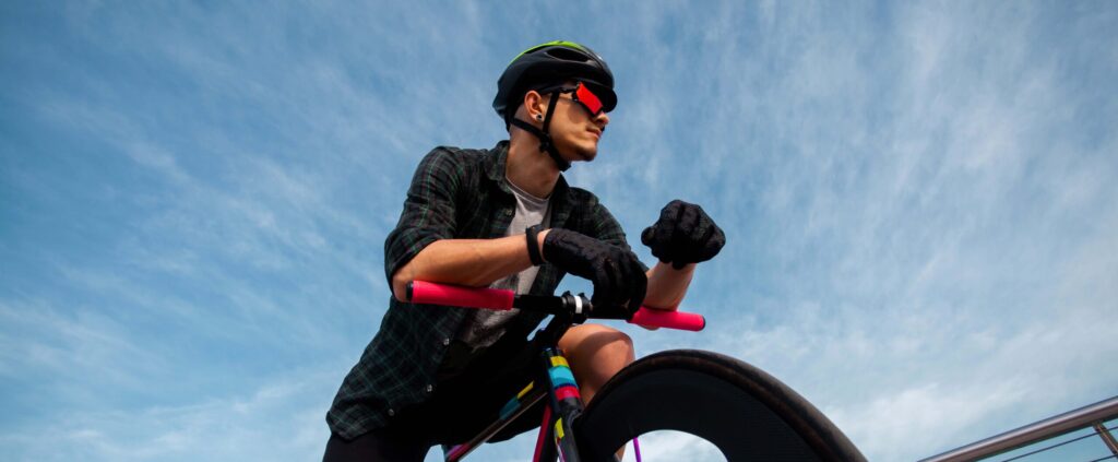 Embracing Low Heart Rate Training and Nutrition in Endurance Sports 9 a man wearing helmet and sunglasses riding a bicycle